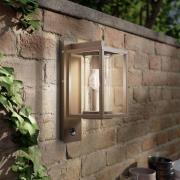 Lucande utomhusvägglampa Ferda, sensor, pendel, brun, IP44