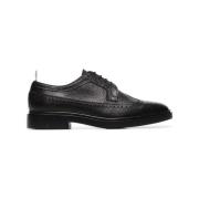 Thom Browne Svarta platta skor med Longwing gummisula Brogue Black, He...