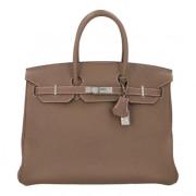 Hermès Vintage Pre-owned Laeder handvskor Beige, Dam